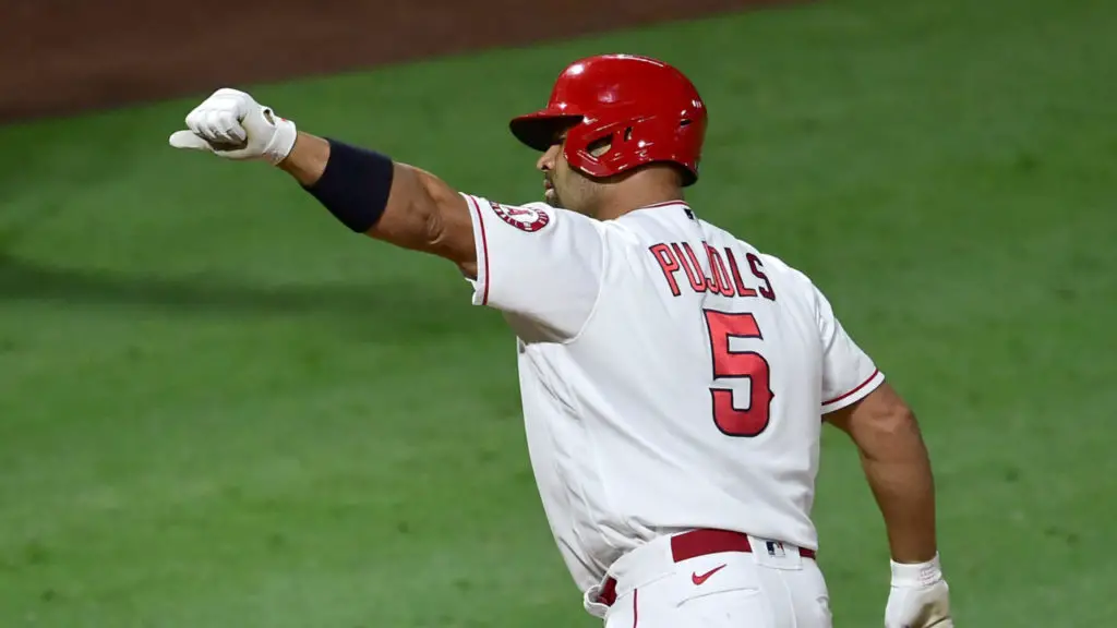 ANAHEIM, CA - SEPTEMBER 18: Albert Pujols #5 of the Los Angeles Angels crosses the plate after hitting career home run No. 661 passing Hall of Famer and San Francisco Giants legend Willie Mays and sole possession session of fifth place on baseballs all-time home run list in the fifth inning of the game against the Texas Rangers at Angel Stadium of Anaheim on September 18, 2020 in Anaheim, California. (Photo by Jayne Kamin-Oncea/Getty Images)