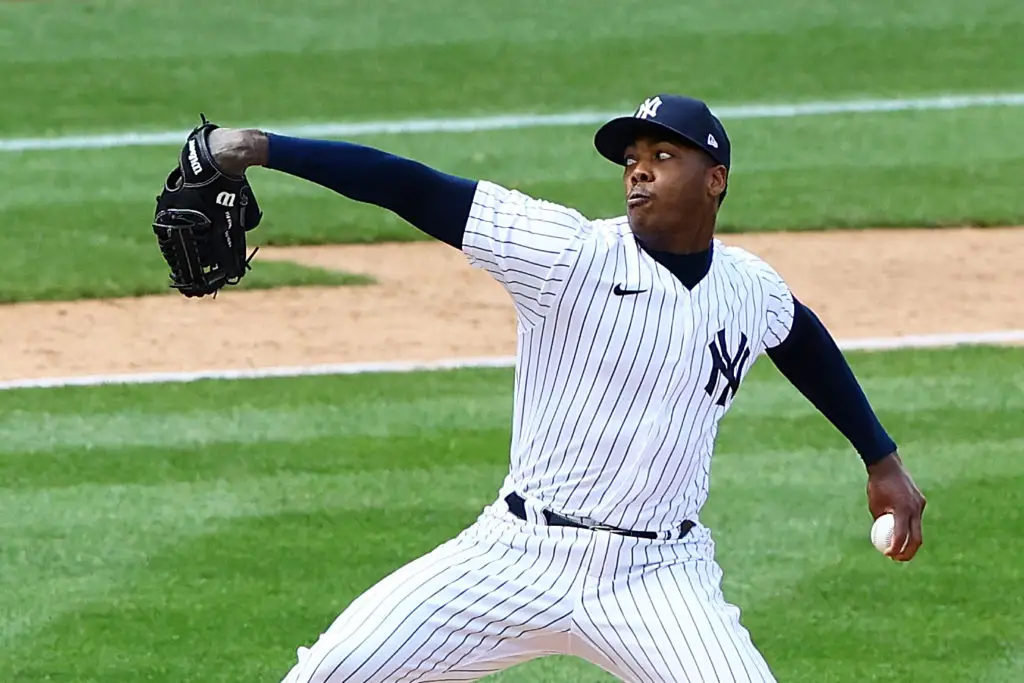 New York Yankees relief pitcher Aroldis Chapman throws a strike in the ninth