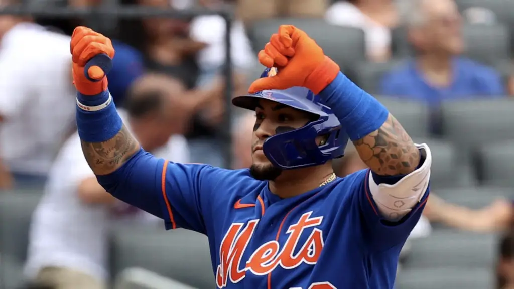 A New York Mets fan gives the thumbs-up as Met and New York