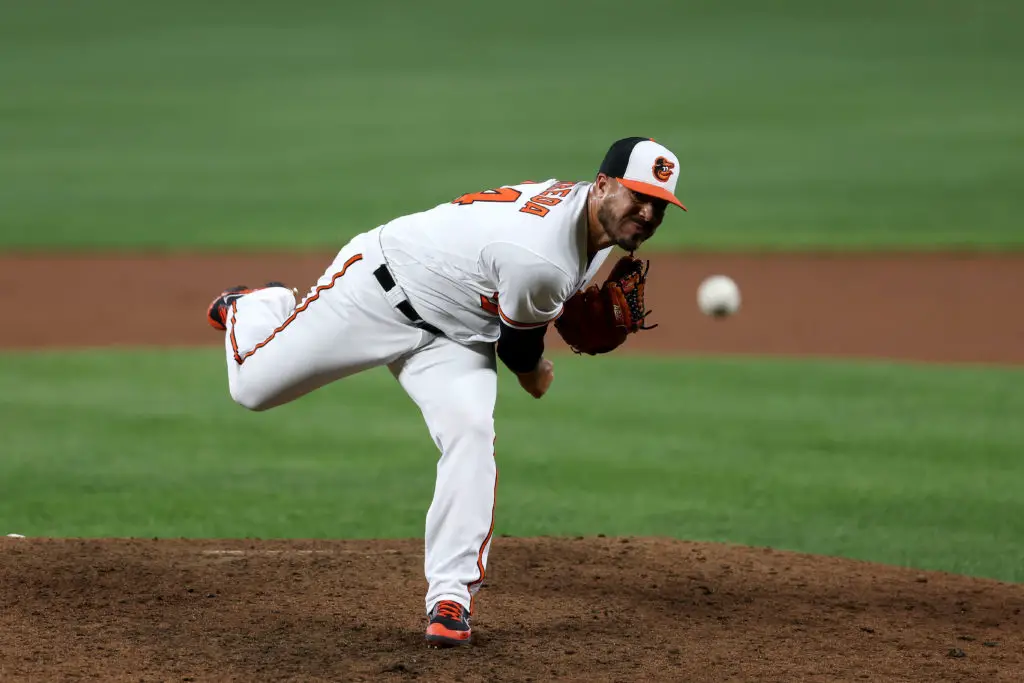 BALTIMORE, MARYLAND - SEPTEMBER 08: Manny Barreda #84 of the Baltimore Orioles makes his MLB debut pitching to a Kansas City Royals batter in the eighth inning at Oriole Park at Camden Yards on September 08, 2021 in Baltimore, Maryland. (Photo by Rob Carr/Getty Images)