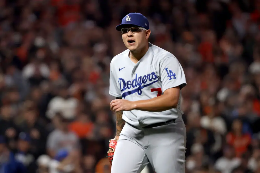 SAN FRANCISCO, CALIFORNIA - OCTOBER 14: Julio Urias #7 of the Los Angeles Dodgers reacts after the third out of the fourth inning against Wilmer Flores #41 of the San Francisco Giants in game 5 of the National League Division Series at Oracle Park on October 14, 2021 in San Francisco, California. (Photo by Harry How/Getty Images)