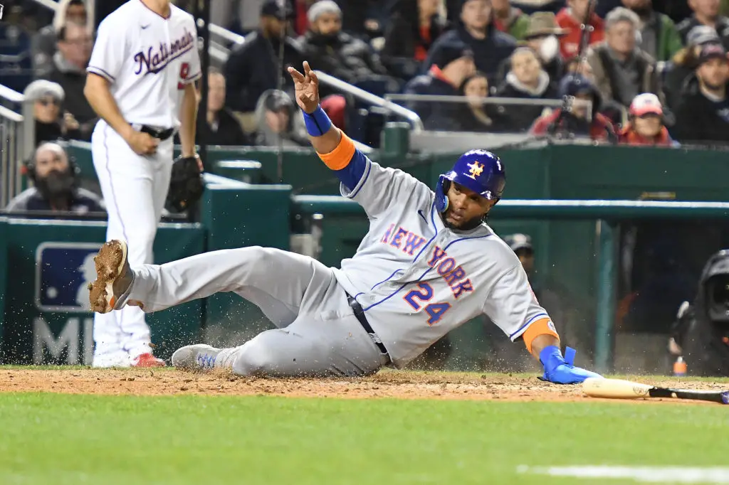 WASHINGTON, DC - APRIL 07:  Robinson Cano #24 of the New York Mets scores on a Jeff McNeil #1 single in the sixth inning during a baseball game against the Washington Nationals on Opening Day at the Nationals Park on April 7, 2022 in Washington, DC.  (Photo by Mitchell Layton/Getty Images)