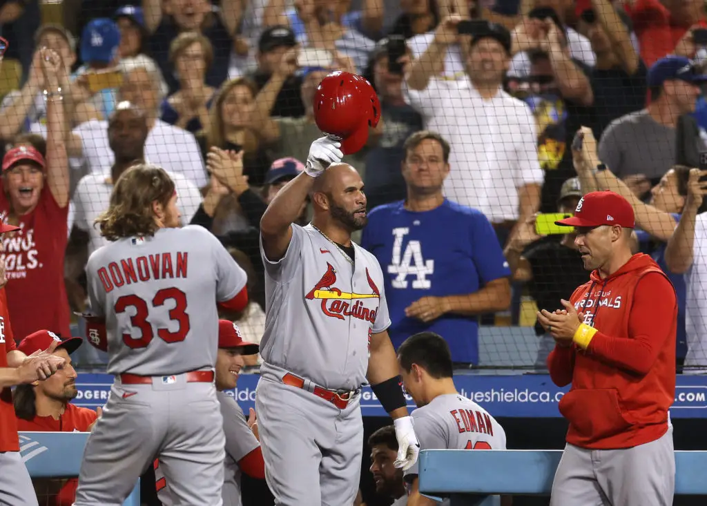 LOS ANGELES, CALIFORNIA - SEPTEMBER 23: Albert Pujols #5 of the St. Louis Cardinals tips his hat to fans after hitting his 700th career homerun, his second homerun of the game, to take a 5-0 lead over the Los Angeles Dodgers during the fourth inning at Dodger Stadium on September 23, 2022 in Los Angeles, California. (Photo by Harry How/Getty Images)