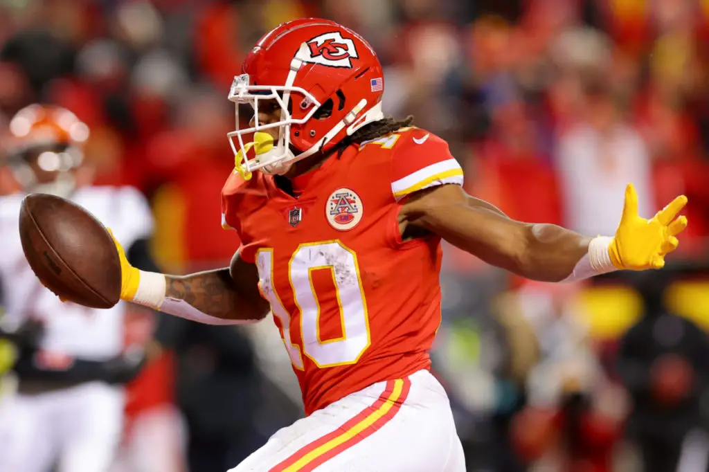 Kansas City Chiefs running back Isiah Pacheco celebrates with fans